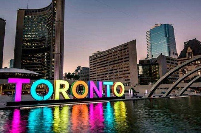 City Sightseeing Toronto Guided Night Bus Tour - CN Tower views and Rogers Centre in the skyline spotlight