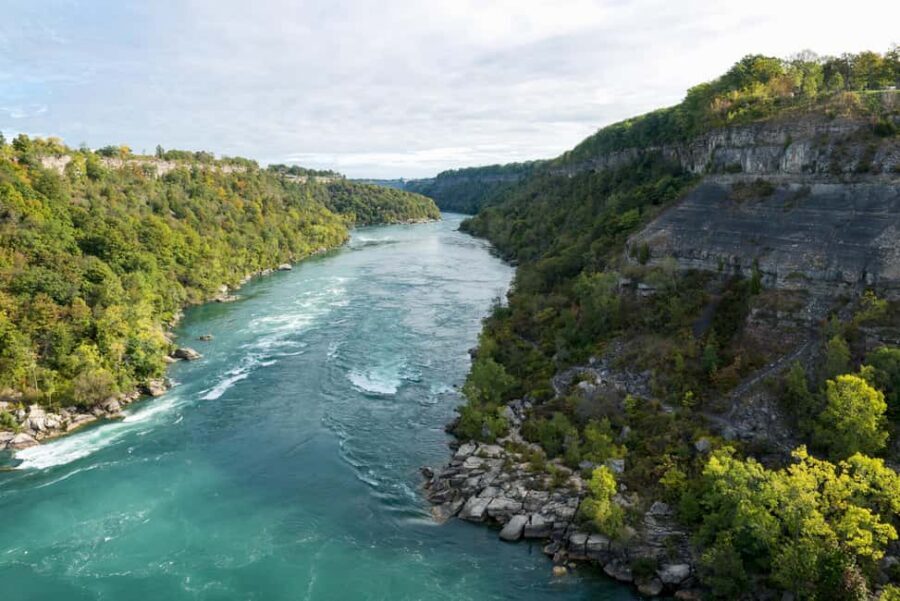 From Toronto: Niagara Falls Bus Tour with Boat Cruise - Morning pickups and the 1.5-hour drive with live commentary