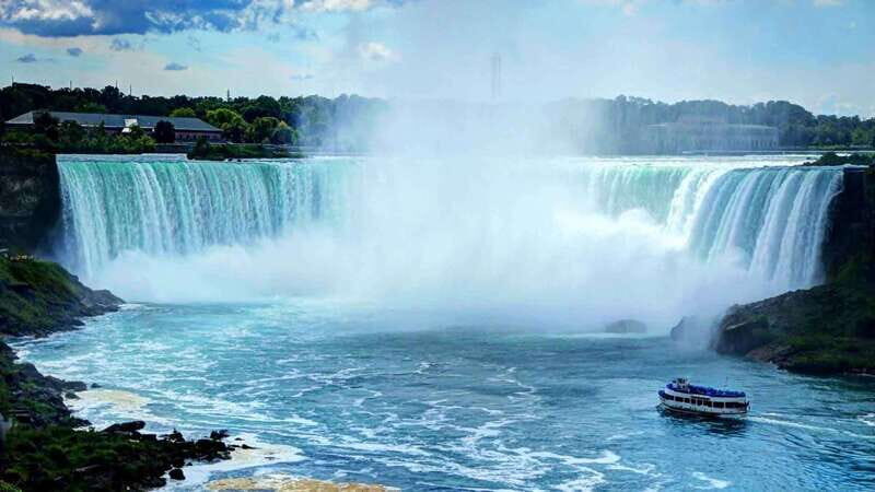 From Toronto: Niagara Falls Evening Tour With Boat Cruise - Journey Behind the Falls: seeing the roar from inside the action
